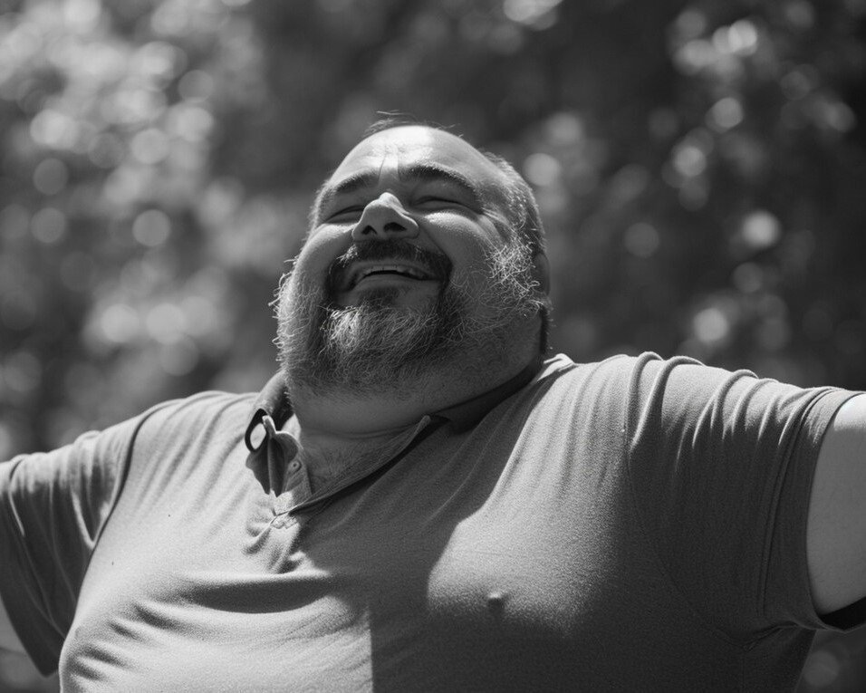 Smiling man enjoying the outdoors, representing confidence and improved well-being.